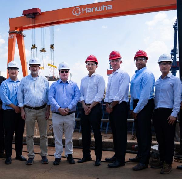 Russell Vought, Director of the Office of Management and Budget (second from eft), US Navy Secretary John Phelan (third from left) and Hanwha Group Vice Chair Kim Dong-kwan (fourth from left) pose for a photo on July 30, 2025 after touring Hanwha Philly Shipyard in the US. (Hanwha Group)